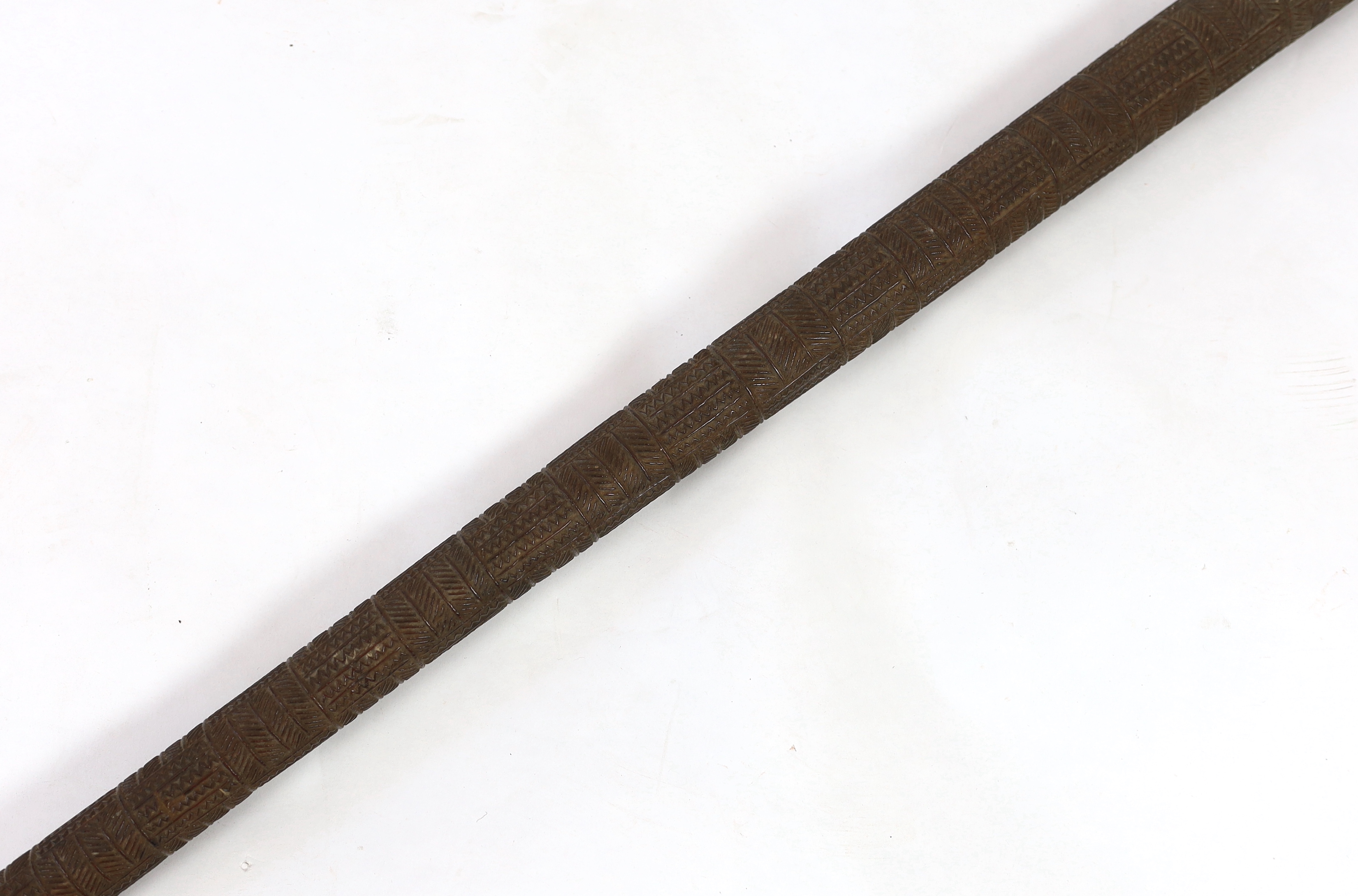 A Polynesian tribal Povai pole war club, Tonga, 19th century, 100cm long, 5cm largest diameter